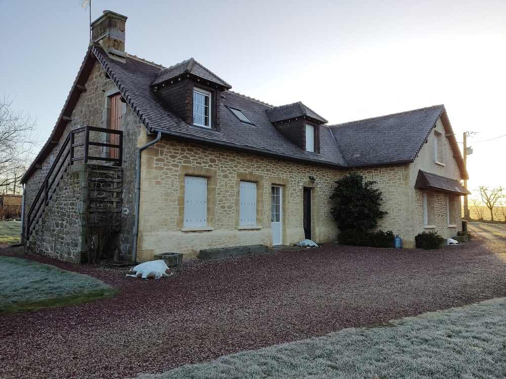 Stone facade of Le Mont Rôti Chambres d’Hôtes in Faverolles, Normandy
